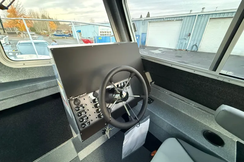 Slide: The Image of Interior view of 2026 KingFisher 2625 Coastal Express boat cockpit with steering wheel. - 18