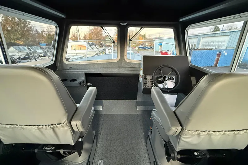 Slide: The Image of Interior of 2026 KingFisher 2625 Coastal Express boat with dual seats and steering console. - 19