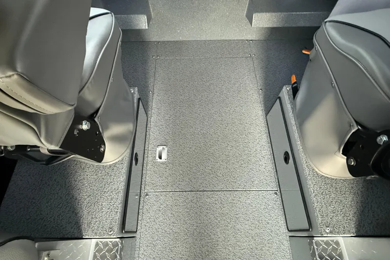 Slide: The Image of Interior view of 2026 KingFisher 2625 Coastal Express boat, featuring seating and flooring details. - 25