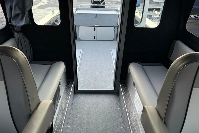 Slide: The Image of Interior of 2026 KingFisher 2625 Coastal Express boat, featuring seating and storage. - 31