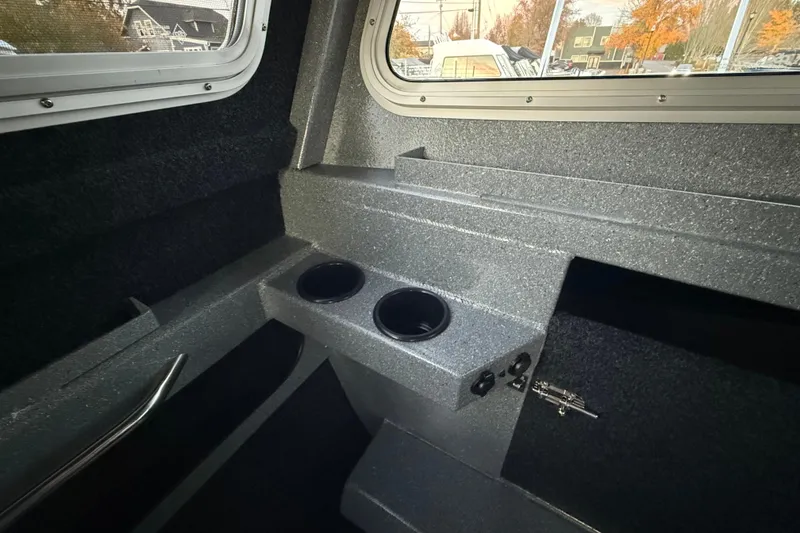 Slide: The Image of Interior of 2026 KingFisher 2625 Coastal Express boat with cup holders and windows. - 39