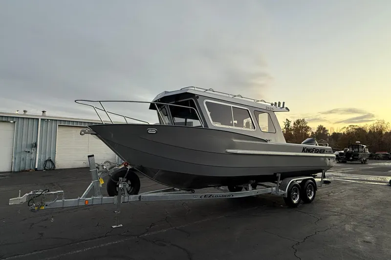 Slide: The Image of 2026 KingFisher 2625 Coastal Express boat on trailer at sunset. - 42