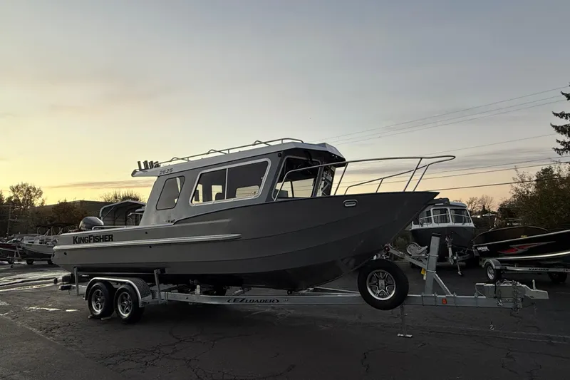 Slide: The Image of 2026 KingFisher 2625 Coastal Express boat on trailer at sunset. - 43