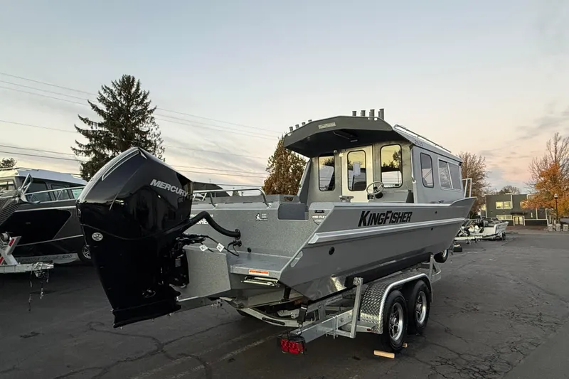 Slide: The Image of 2026 KingFisher 2625 Coastal Express boat on trailer, featuring Mercury outboard motor. - 45