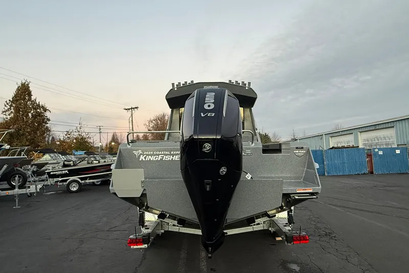 Slide: The Image of 2026 KingFisher 2625 Coastal Express boat with powerful outboard motor in a parking lot. - 46