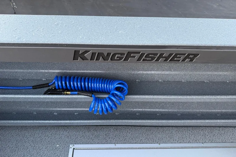 Slide: The Image of 2026 KingFisher 2625 Coastal Express boat with coiled blue cable on deck. - 8