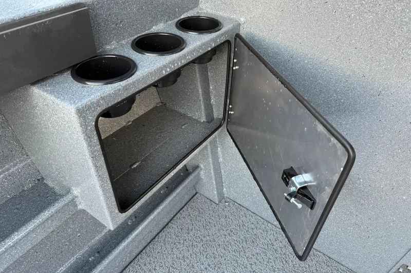 Slide: The Image of Storage compartment with cup holders on a 2026 KingFisher 2625 Coastal Express boat. - 9