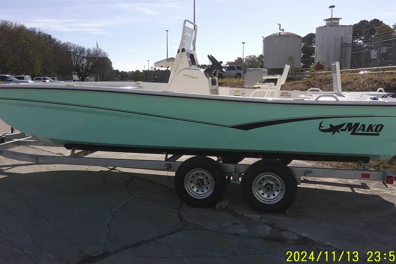 The Image of 2024 Mako Pro Skiff 19 CC boat on trailer, parked outdoors. - 0