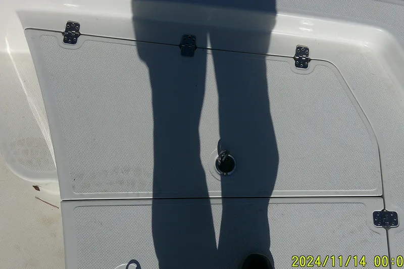 Slide: The Image of 2024 Mako Pro Skiff 19 CC deck with shadow and hatch details. - 11