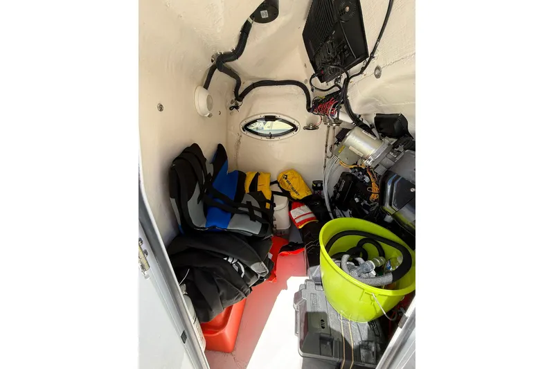 Slide: The Image of Interior of 2024 TwinVee 240 CFX CC boat with safety gear and equipment. - 8
