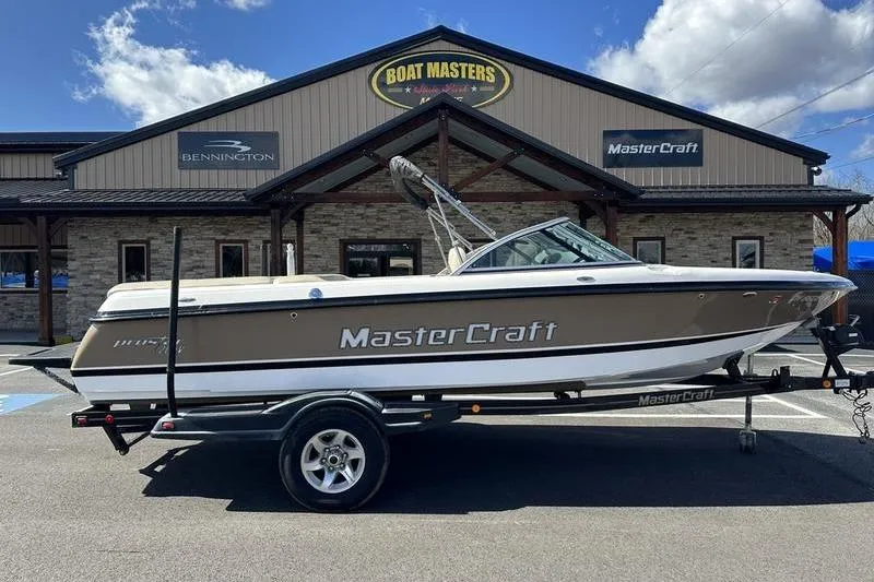 The Image of 2005 Master Craft Pro Star 205 boat on trailer outside Boat Masters dealership. - 1