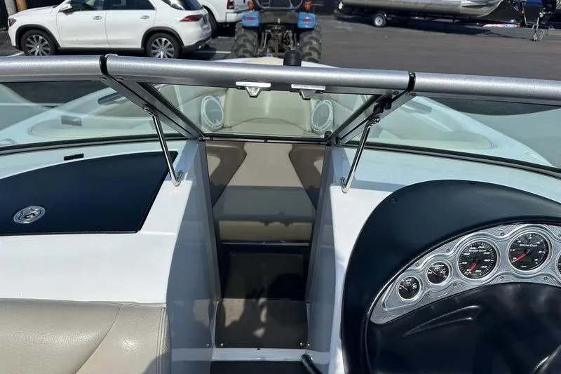 Slide: The Image of 2005 Master Craft Pro Star 205 boat interior with dashboard and seating area. - 17