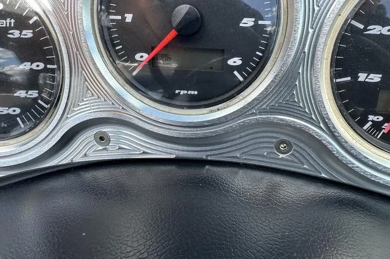 Slide: The Image of Dashboard gauges of a 2005 Master Craft Pro Star 205 boat. - 18