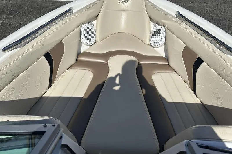 Slide: The Image of 2005 Master Craft Pro Star 205 boat interior with beige seating and speakers. - 19