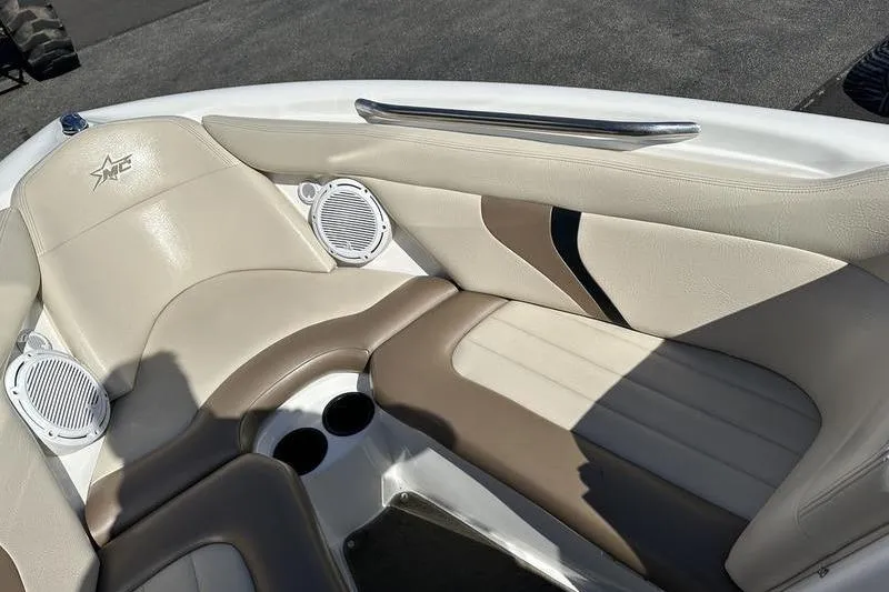 Slide: The Image of Interior of a 2005 Master Craft Pro Star 205 boat with beige seating. - 21