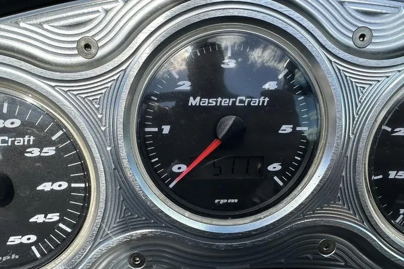 Slide: The Image of Close-up of MasterCraft Pro Star 205 2005 dashboard gauges, showing RPM and speed. - 3