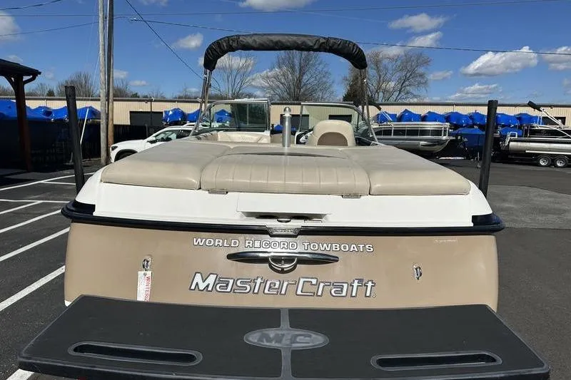 Slide: The Image of 2005 Master Craft Pro Star 205 boat, rear view, parked outdoors under blue sky. - 5