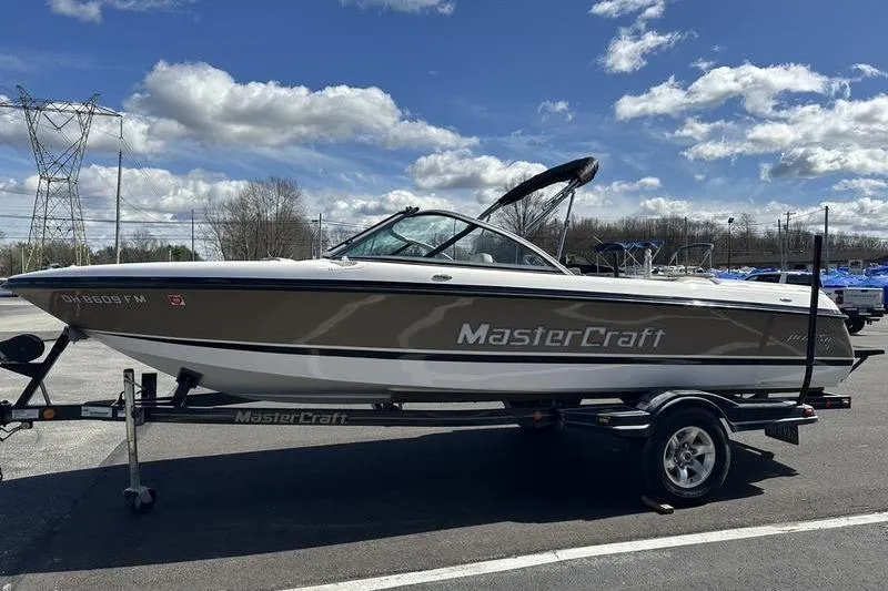 Slide: The Image of 2005 Master Craft Pro Star 205 boat on trailer under blue sky. - 9