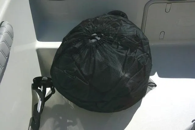 Slide: The Image of Black mesh bag in a 2024 Carolina Skiff 21 LS boat interior. - 17