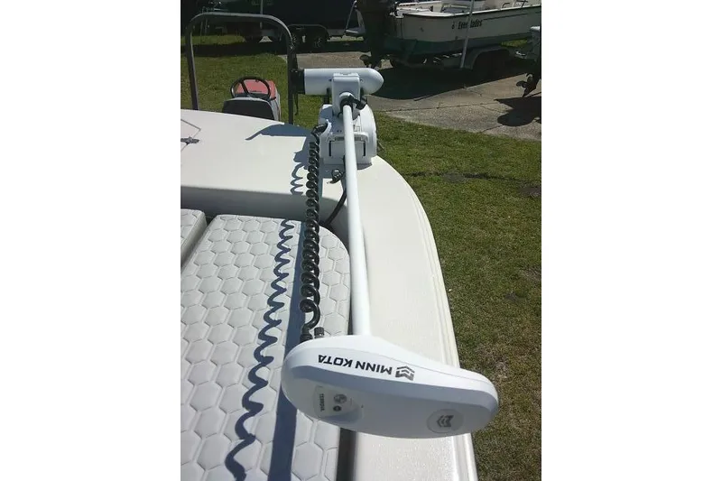 Slide: The Image of 2024 Carolina Skiff 21 LS boat with Minn Kota trolling motor on deck. - 19
