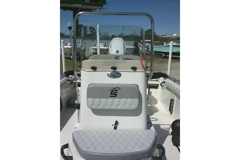 Slide: The Image of 2024 Carolina Skiff 21 LS boat interior with console and seating, showcasing modern design. - 22