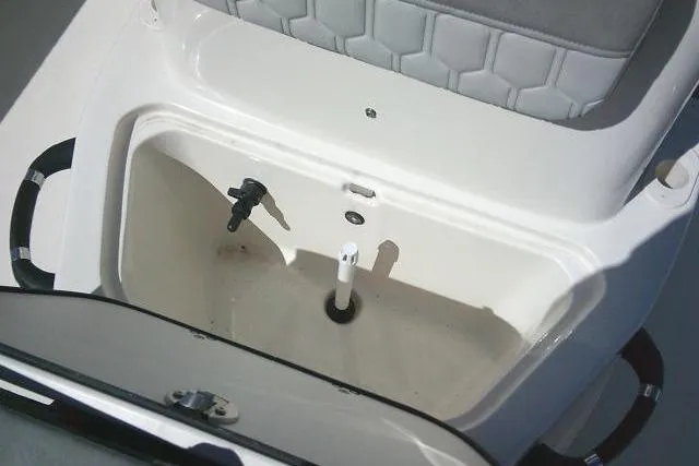 Slide: The Image of 2024 Carolina Skiff 21 LS boat storage compartment with cushioned seating. - 23