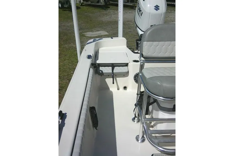Slide: The Image of 2024 Carolina Skiff 21 LS boat interior with seating and motor detail. - 26