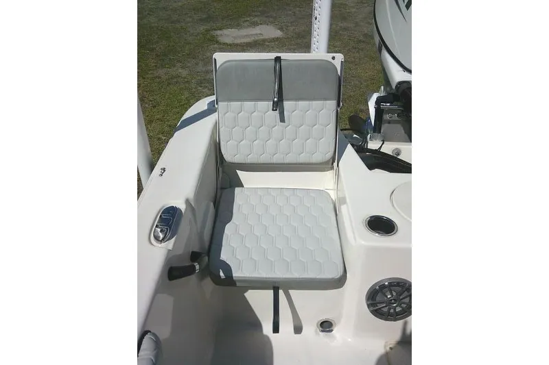 Slide: The Image of 2024 Carolina Skiff 21 LS boat seat with hexagonal pattern and cup holder. - 27