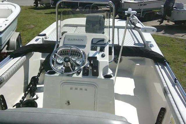 Slide: The Image of 2024 Carolina Skiff 21 LS boat interior with Garmin navigation system and steering wheel. - 31