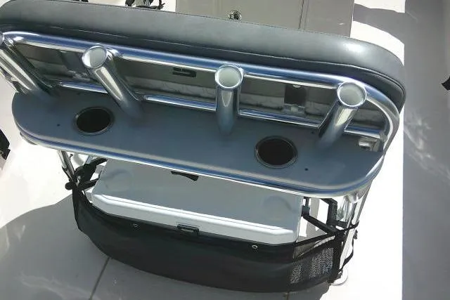 Slide: The Image of 2024 Carolina Skiff 21 LS boat seat with rod holders and storage compartment. - 32