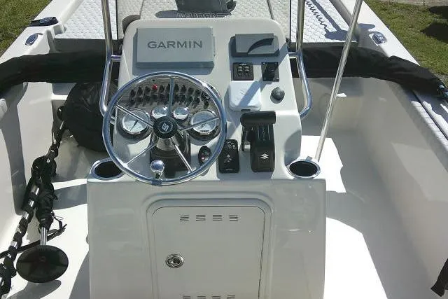 Slide: The Image of 2024 Carolina Skiff 21 LS boat console with Garmin navigation system and steering wheel. - 33