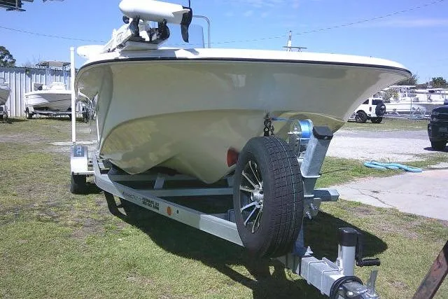 Slide: The Image of 2024 Carolina Skiff 21 LS boat on trailer, parked outdoors. - 5