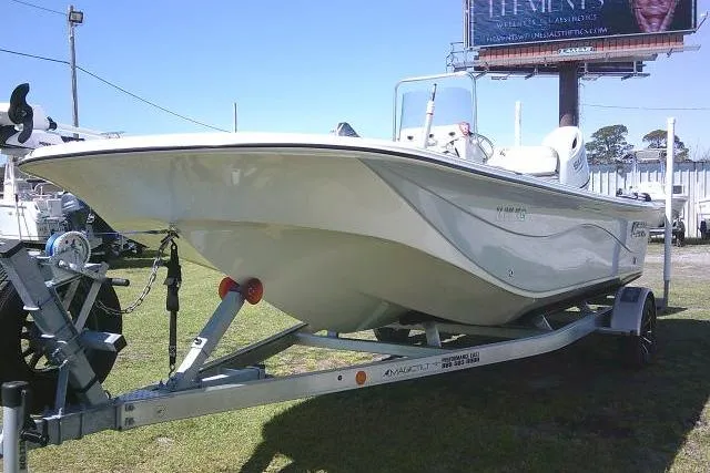 Slide: The Image of 2024 Carolina Skiff 21 LS boat on trailer, displayed outdoors. - 6