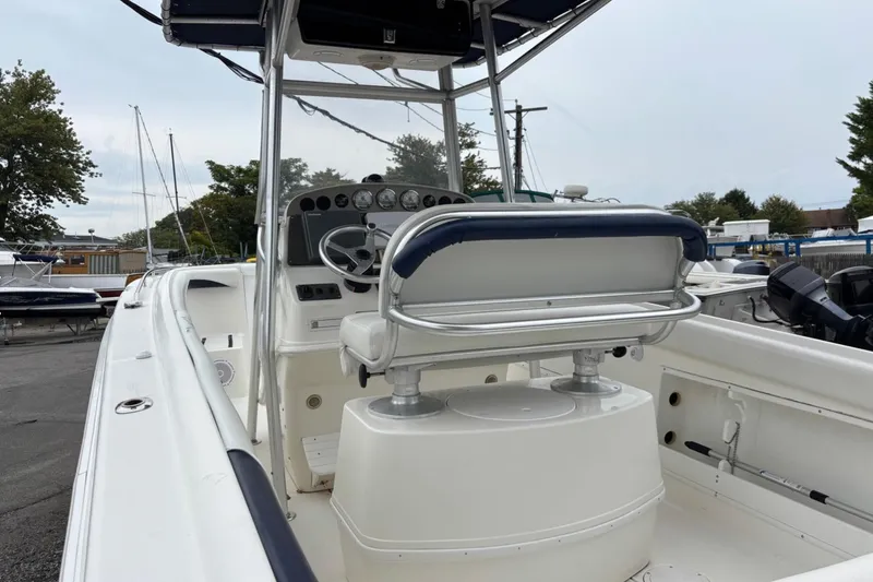 Slide: The Image of 1999 Wellcraft 302 Scarab Sport boat interior with steering console and seating. - 3