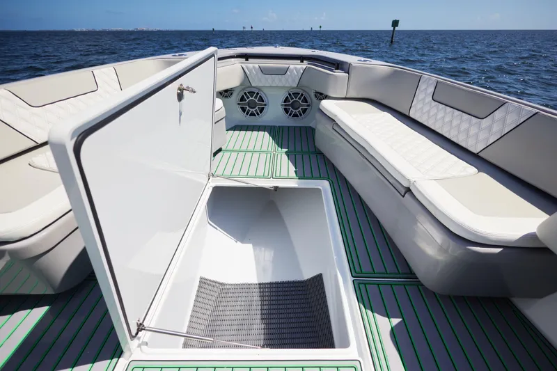 Slide: The Image of 2022 Contender 44 ST boat dashboard with dual Garmin displays and modern controls. - 15