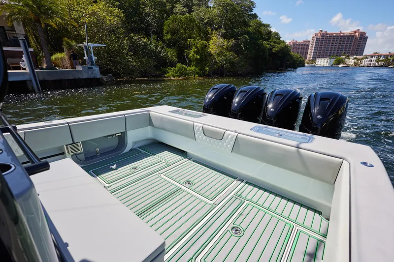 Slide: The Image of 2022 Contender 44 ST boat interior with captain at helm on open water. - 17