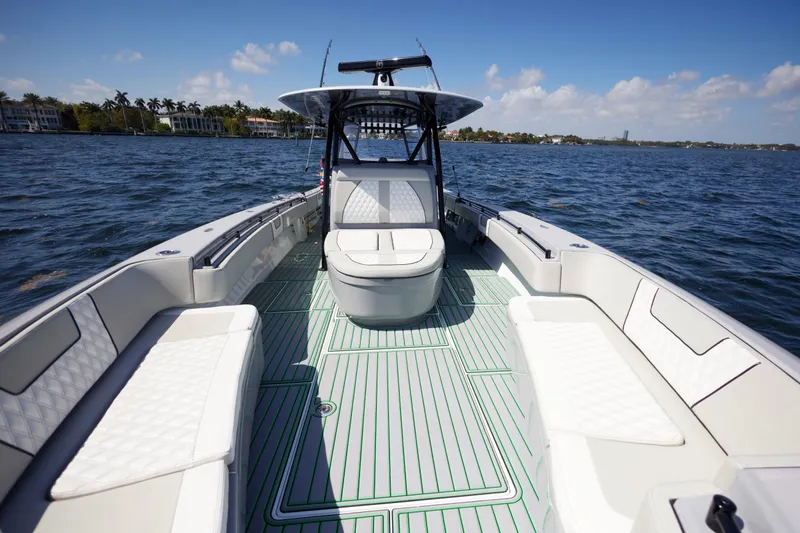 Slide: The Image of 2022 Contender 44 ST boat with spacious seating on open water. - 19