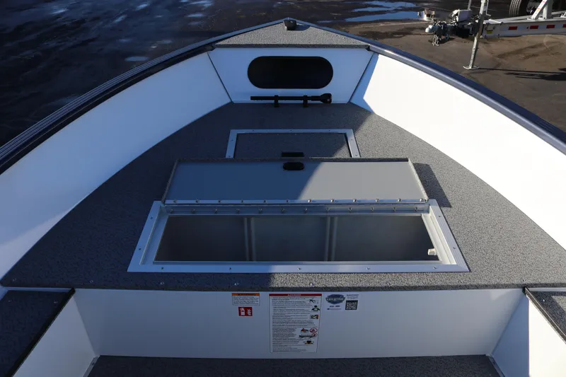 Slide: The Image of 2026 Smoker Craft Pro Lodge 160 boat interior with storage compartments. - 11