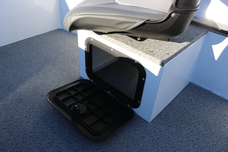 Slide: The Image of 2026 Smoker Craft Pro Lodge 160 boat seat with open storage compartment. - 20