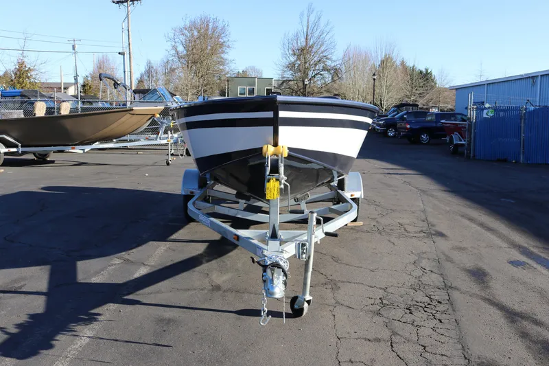 Slide: The Image of 2026 Smoker Craft Pro Lodge 160 boat on trailer in outdoor lot. - 3