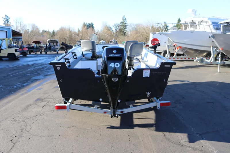 Slide: The Image of 2026 Smoker Craft Pro Lodge 160 boat with Mercury 40 engine, parked outdoors. - 4