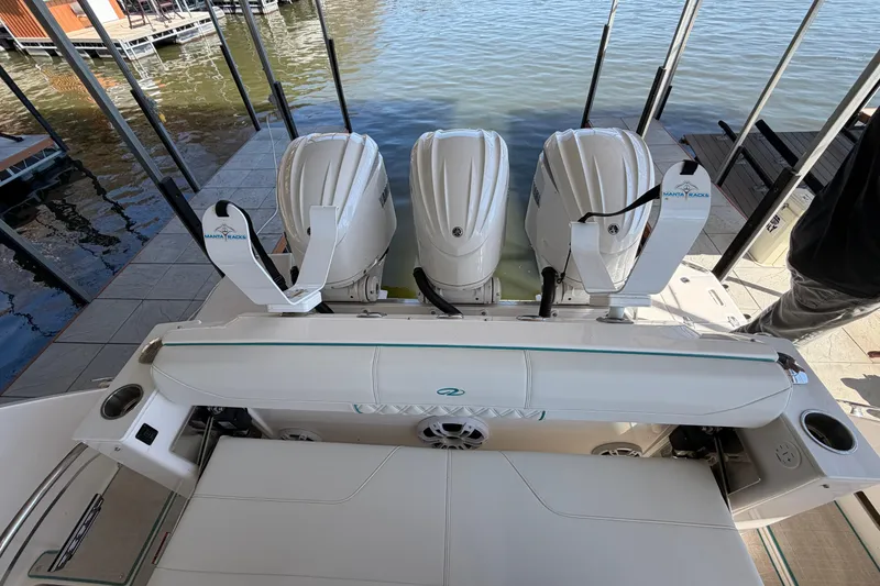 Slide: The Image of 2023 Regal 38 SAV boat docked with Yamaha outboard engine. - 22