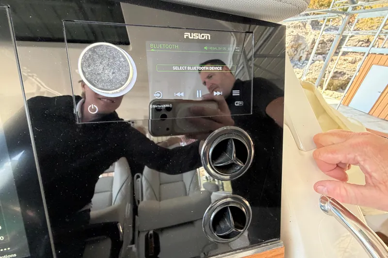 Slide: The Image of 2023 Regal 38 SAV dashboard display with navigation and engine controls. - 39