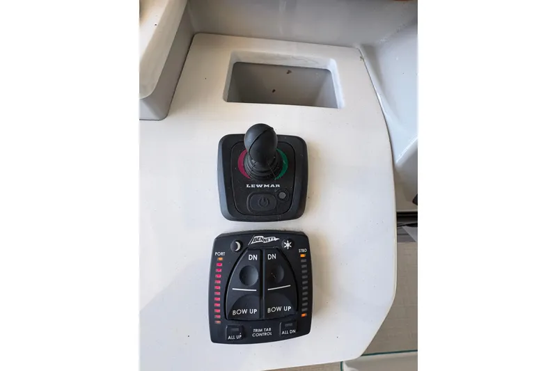 Slide: The Image of Luxurious seating inside 2023 Regal 38 SAV boat with waterfront view. - 43