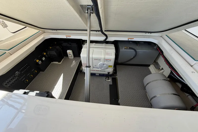 Slide: The Image of Control panel of 2023 Regal 38 SAV boat with various switches and indicators. - 55