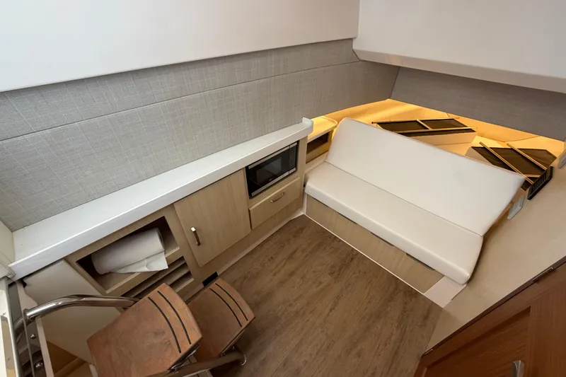 Slide: The Image of 2023 Regal 38 SAV interior cabin with TV and storage. - 66