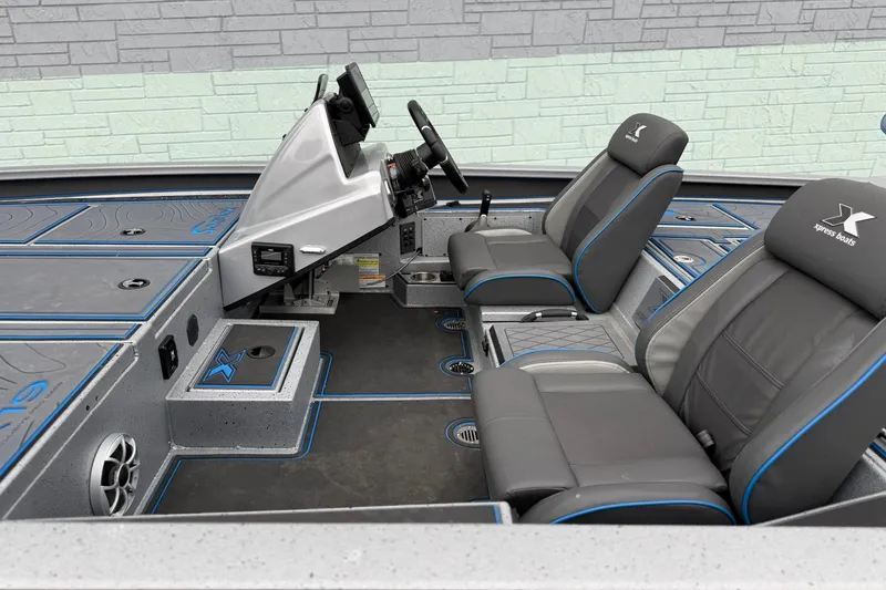 Slide: The Image of Interior of 2026 Xpress X19 Pro boat with modern seating and control panel. - 12