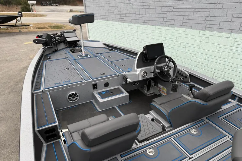 Slide: The Image of 2026 Xpress X19 Pro boat interior with modern dashboard and seating. - 13
