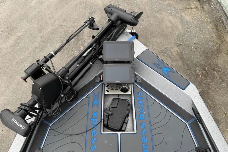 Slide: The Image of 2026 Xpress X19 Pro boat deck with Garmin electronics and trolling motor. - 5