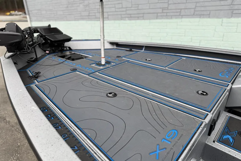 Slide: The Image of 2026 Xpress X19 Pro boat deck with advanced control panel and sleek design. - 6